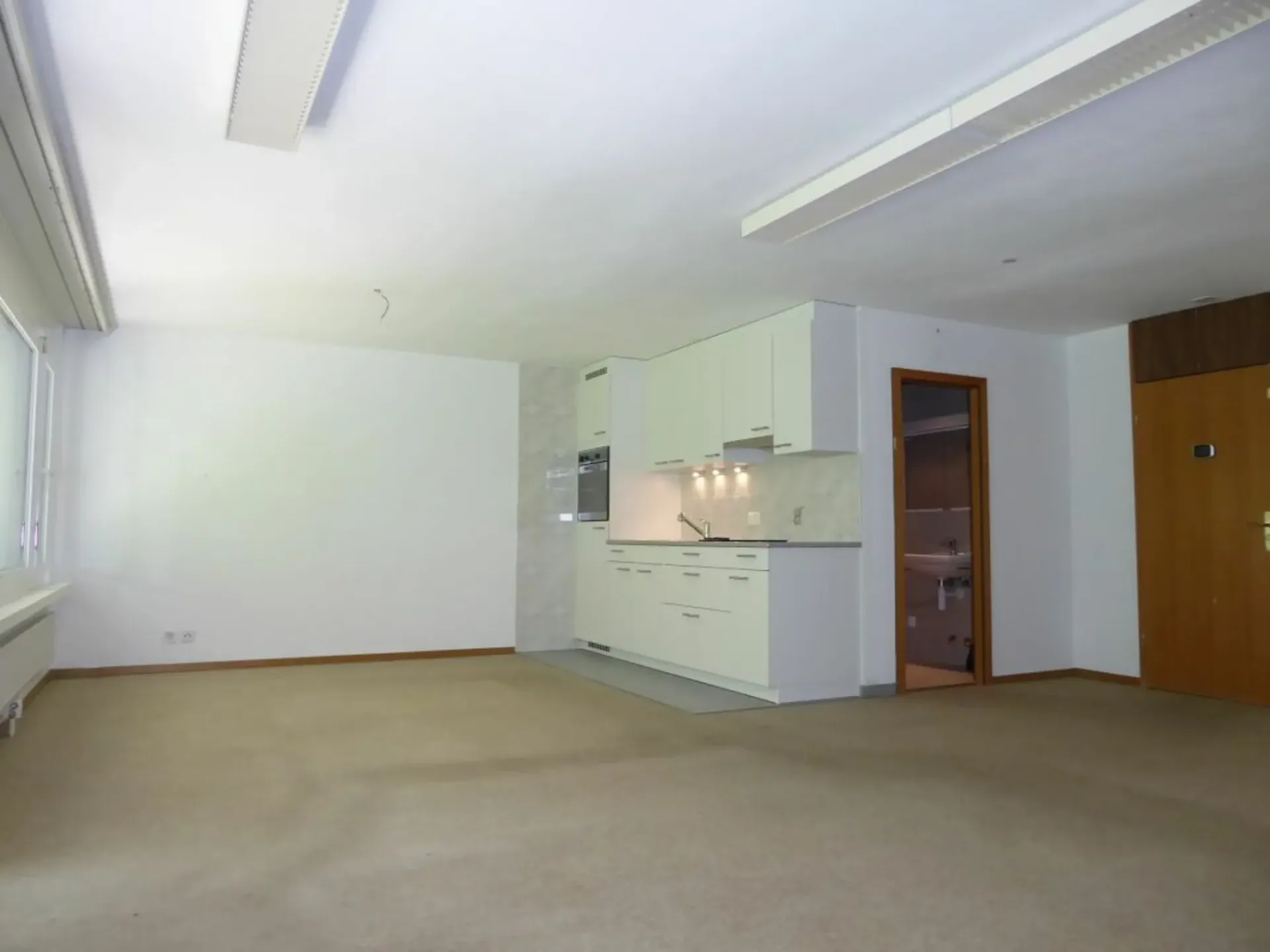 1.5-Zimmer-Studio-Ferienwohnung mit Gartensitzplatz und Tiefgaragenplatz