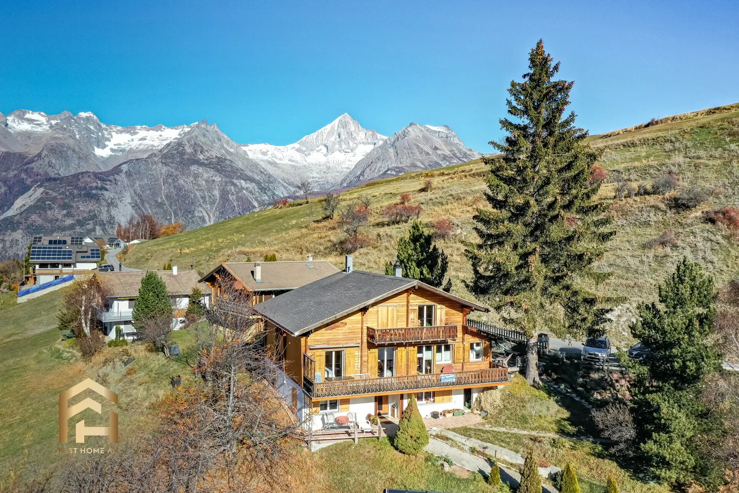 Partially renovated chalet with 4 residential units for sale in Bürchen