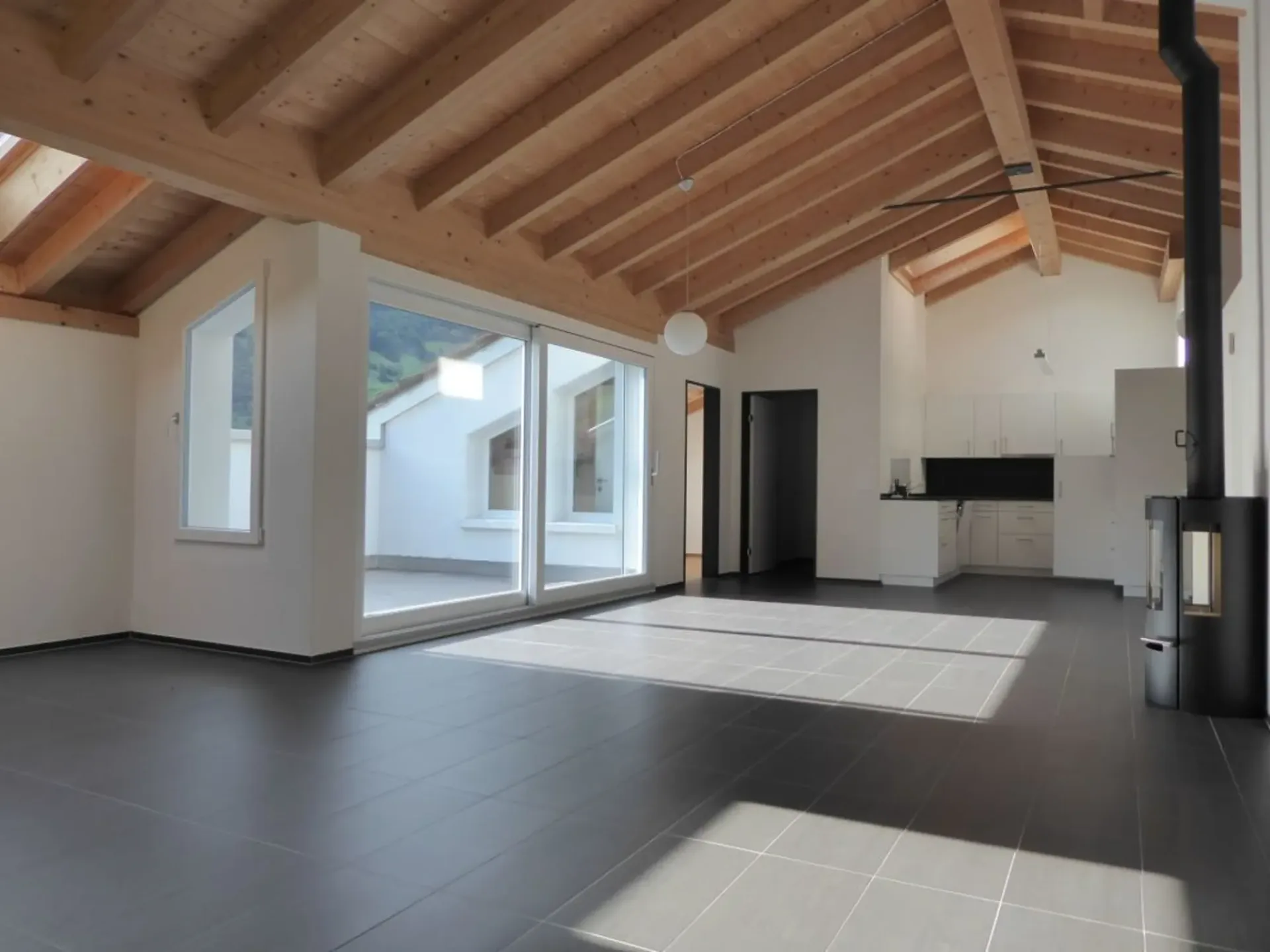 Modern 4.5-room attic apartment with wood stove and balcony