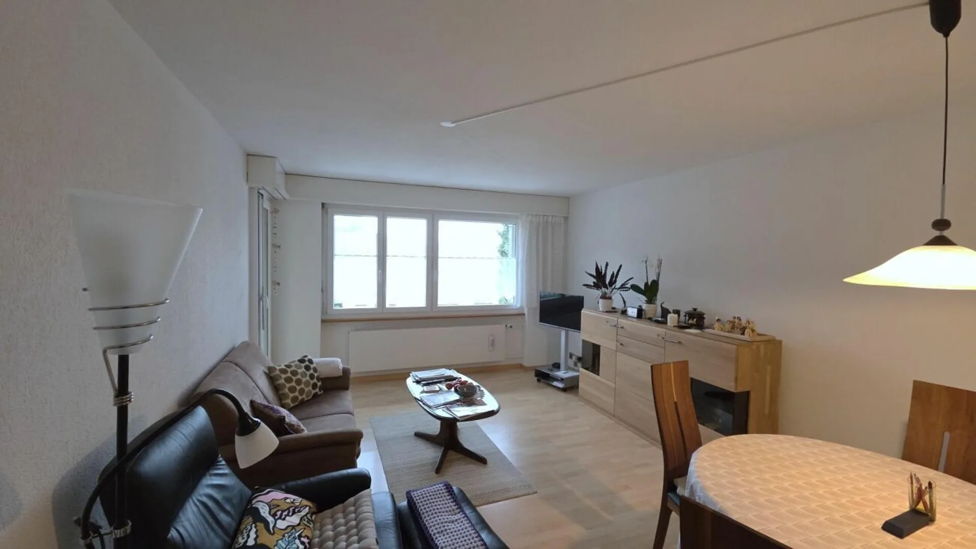 Living in a 3.5-room apartment on the top floor with a balcony